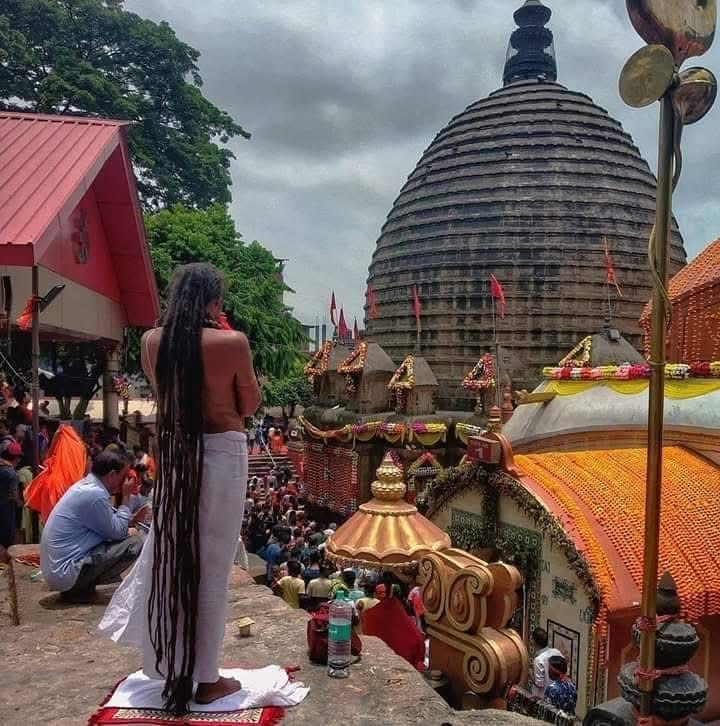 Sadhu with long jata offering prayers at Maa Kamakhya temple for spiritual shakti
